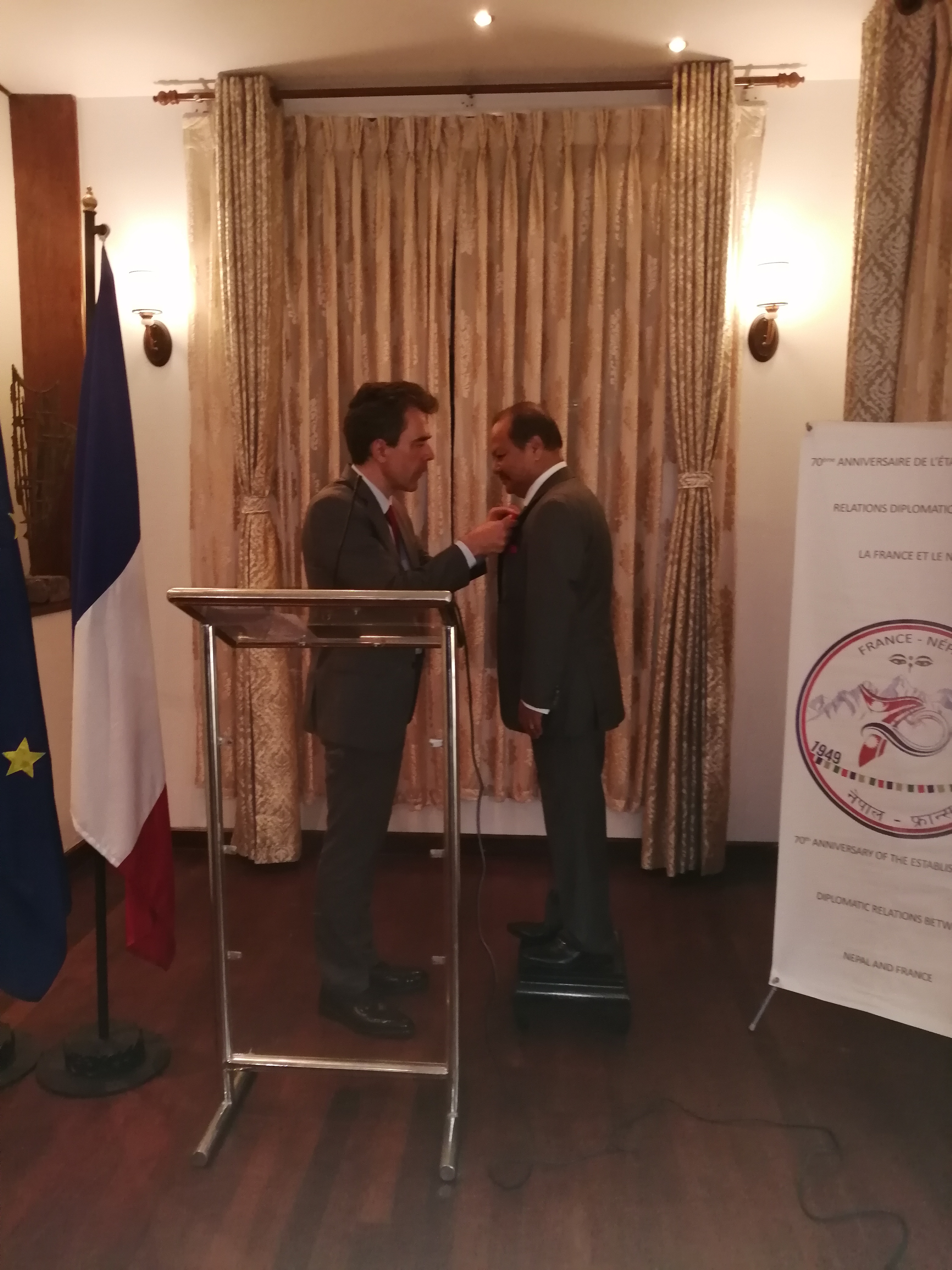 French Ambassador François-Xavier Léger decorating Shyam Mohan Shrestha with the Legion of Honor